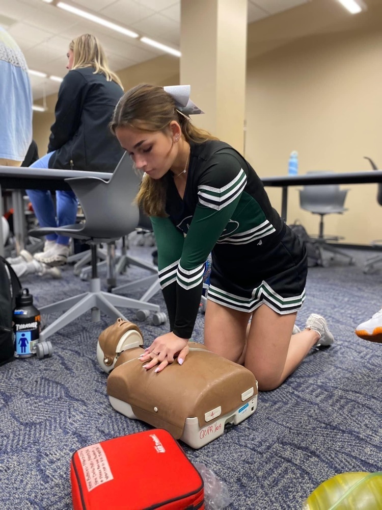 female student practicing cpr